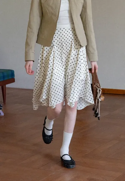 Polka dot asymmetrical hem skirt with pleats