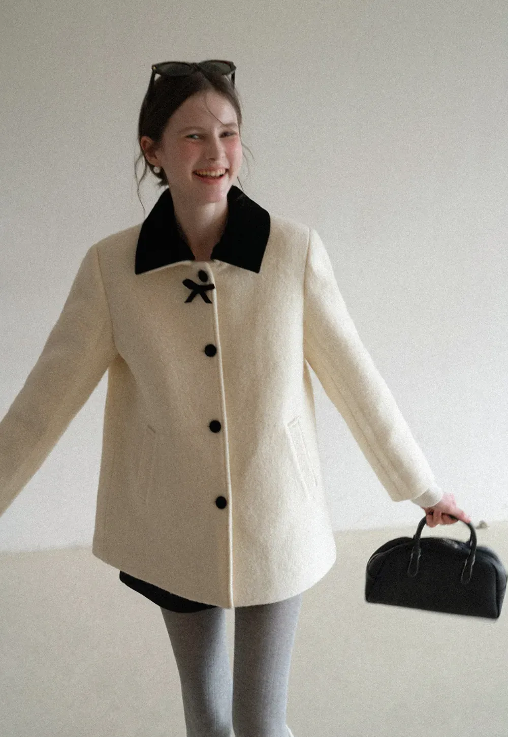 Elegant Wool Coat with Bow Detail and Contrasting Collar