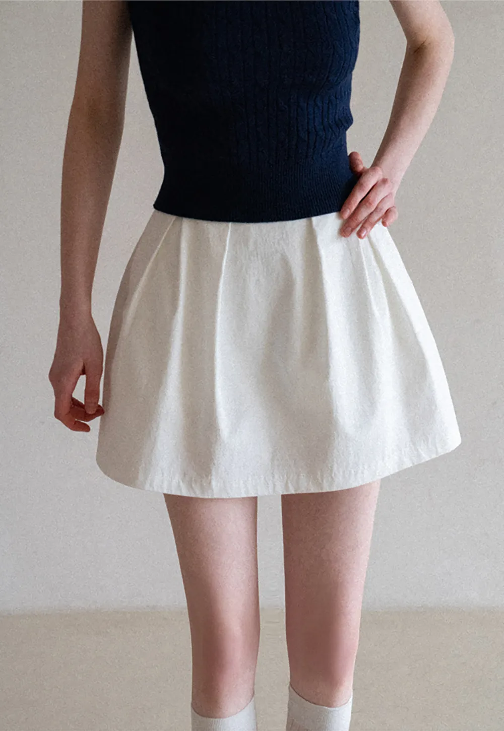 Plaid skirt with pleats and ruffled top