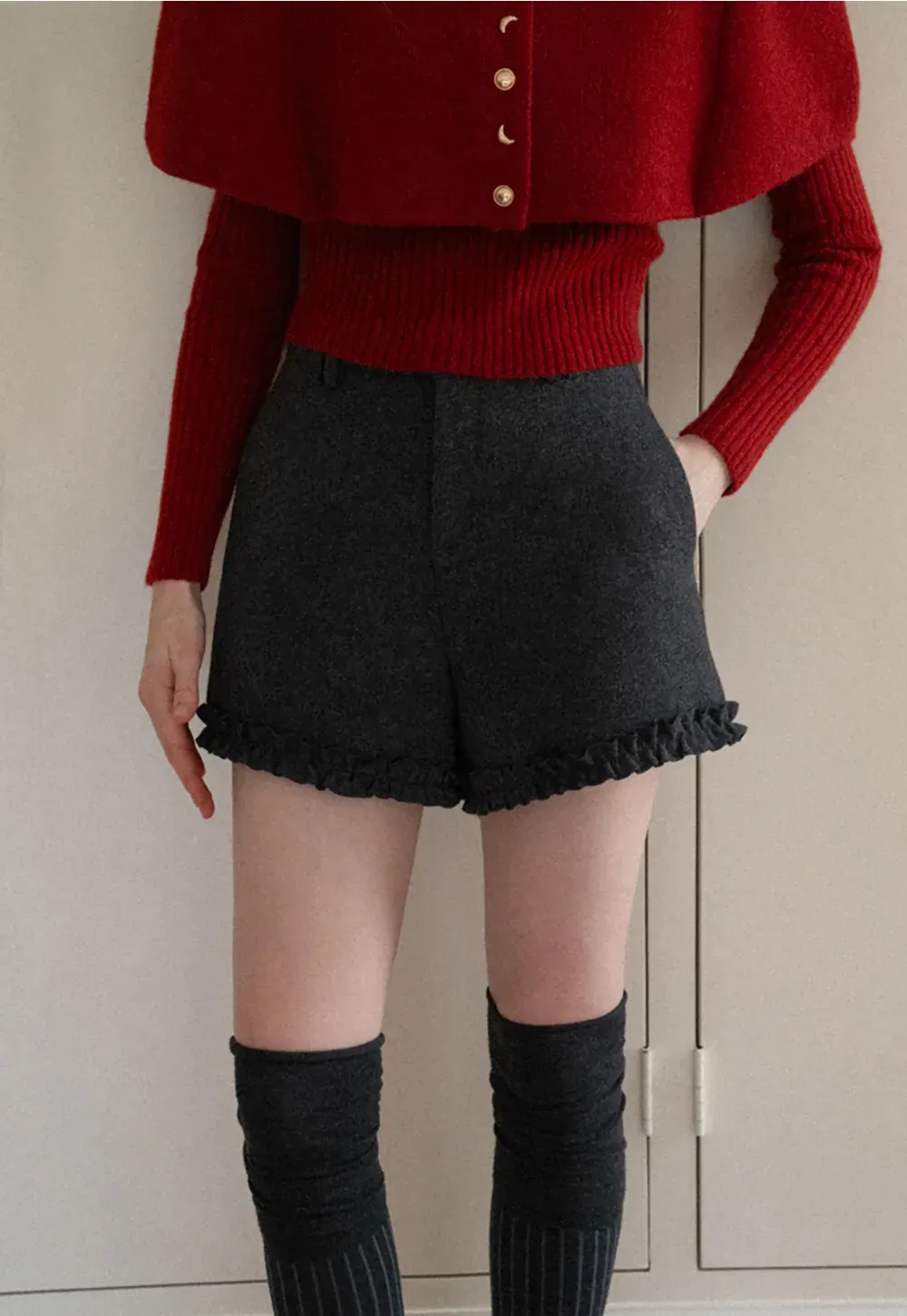 High waist shorts with ruffle hem and belt design