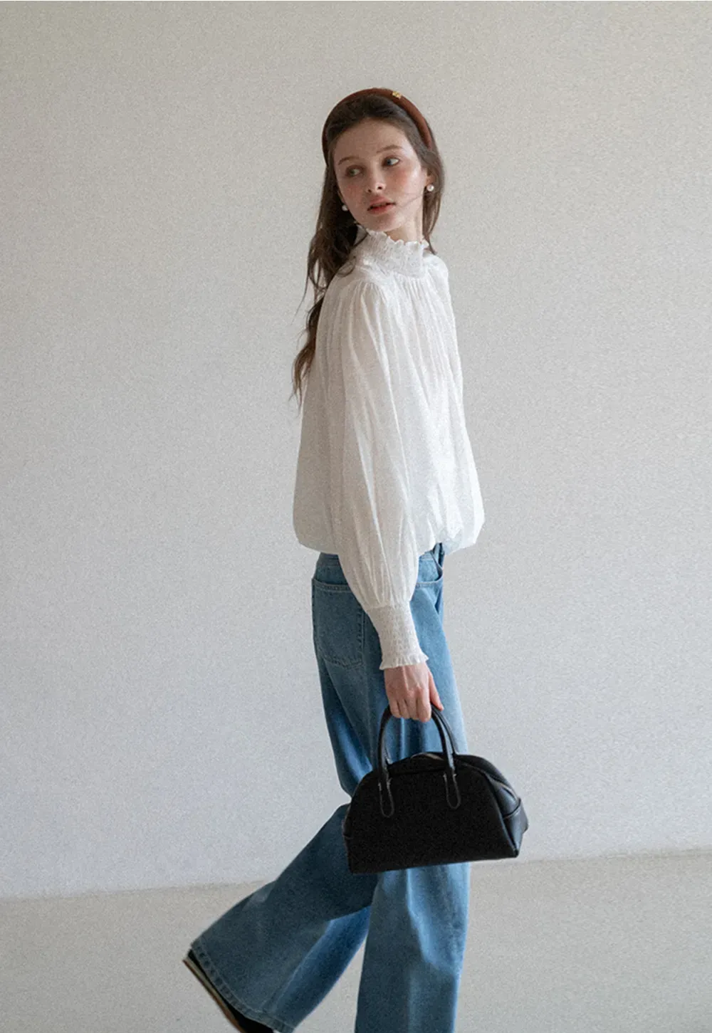 Elegant High Neck Blouse with Ruffled Cuffs and Hem