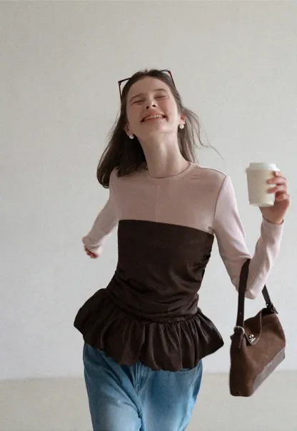 Long sleeve top with ruffled hem and layered design