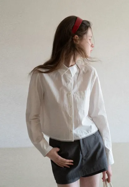 Long sleeve button front shirt with scalloped hem