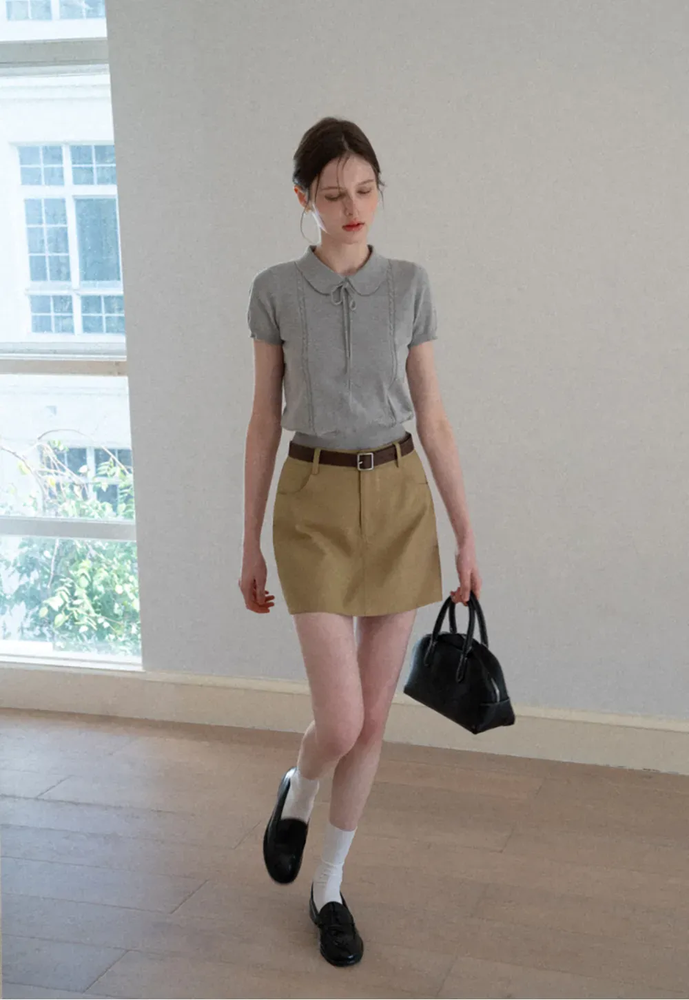 A-line mini skirt with front pockets and belt loops