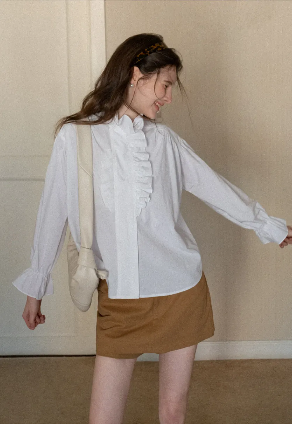 High waist pleated mini skirt with button front design