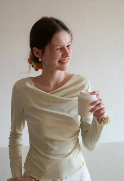 Long sleeve top with ruffled hem and cuffs