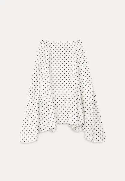 Polka dot asymmetrical hem skirt with pleats