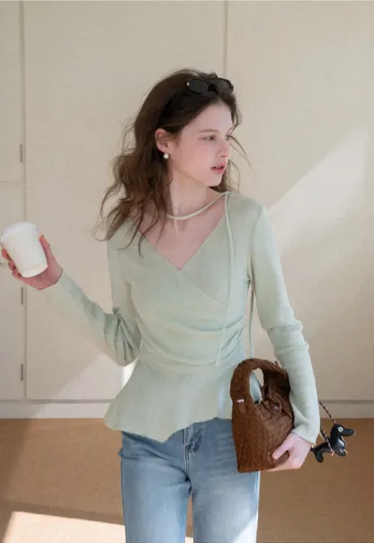 Long sleeve wrap knit sweater with ruched detail