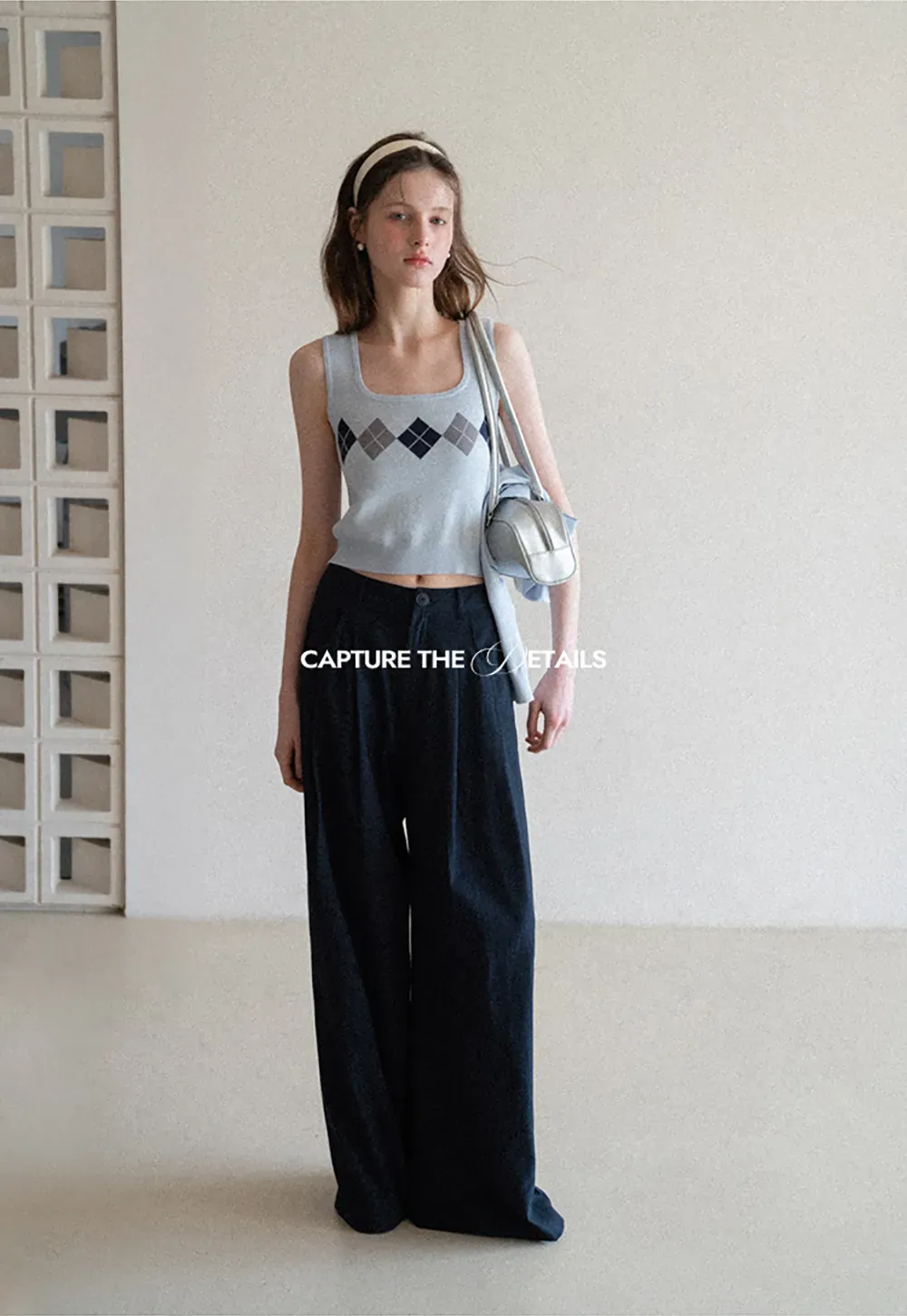 Woolen knit sweater with argyle pattern and buttons