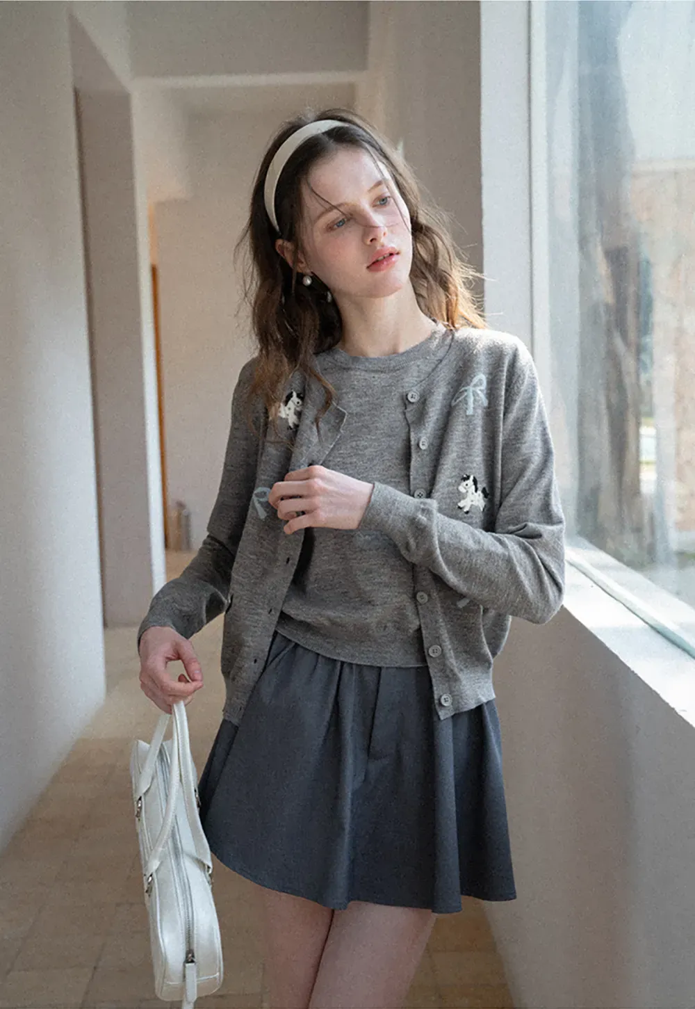 Woolen knit sweater with horse and bow motifs