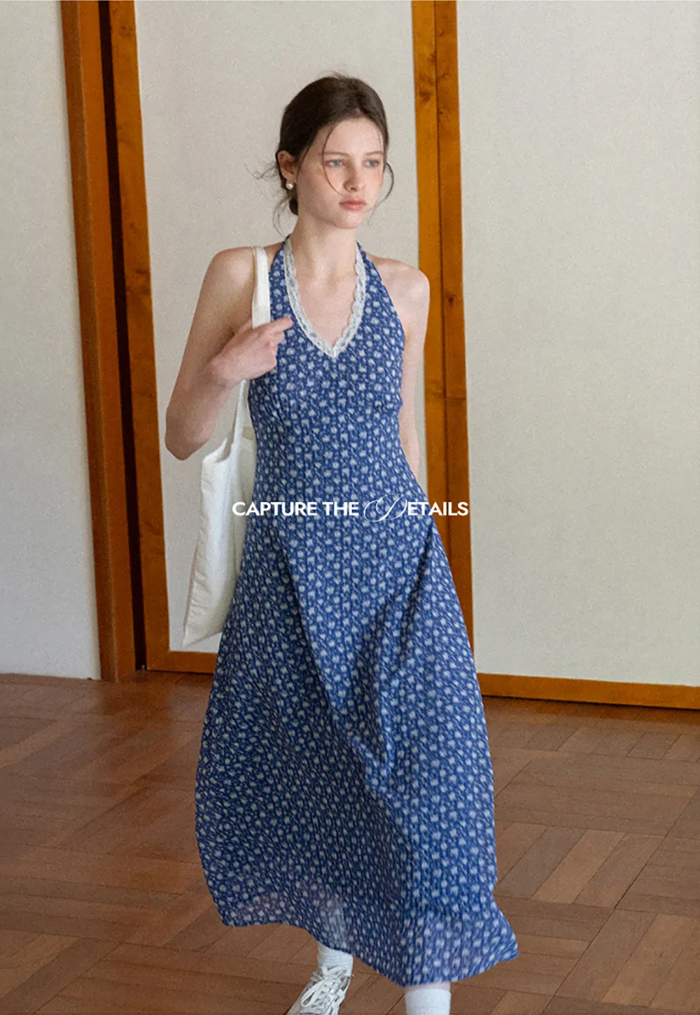 Halter neck dress with floral print and lace trim