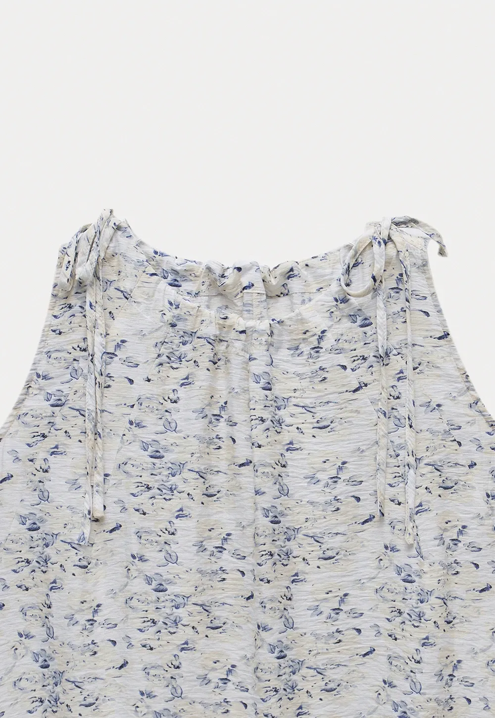 Floral Sleeveless Blouse with Ruffle Hem