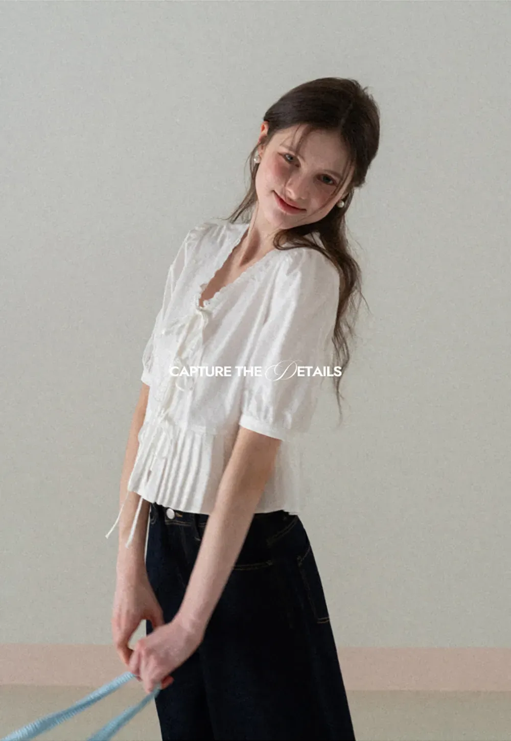 V neck short sleeve blouse with pleated hem and tie front