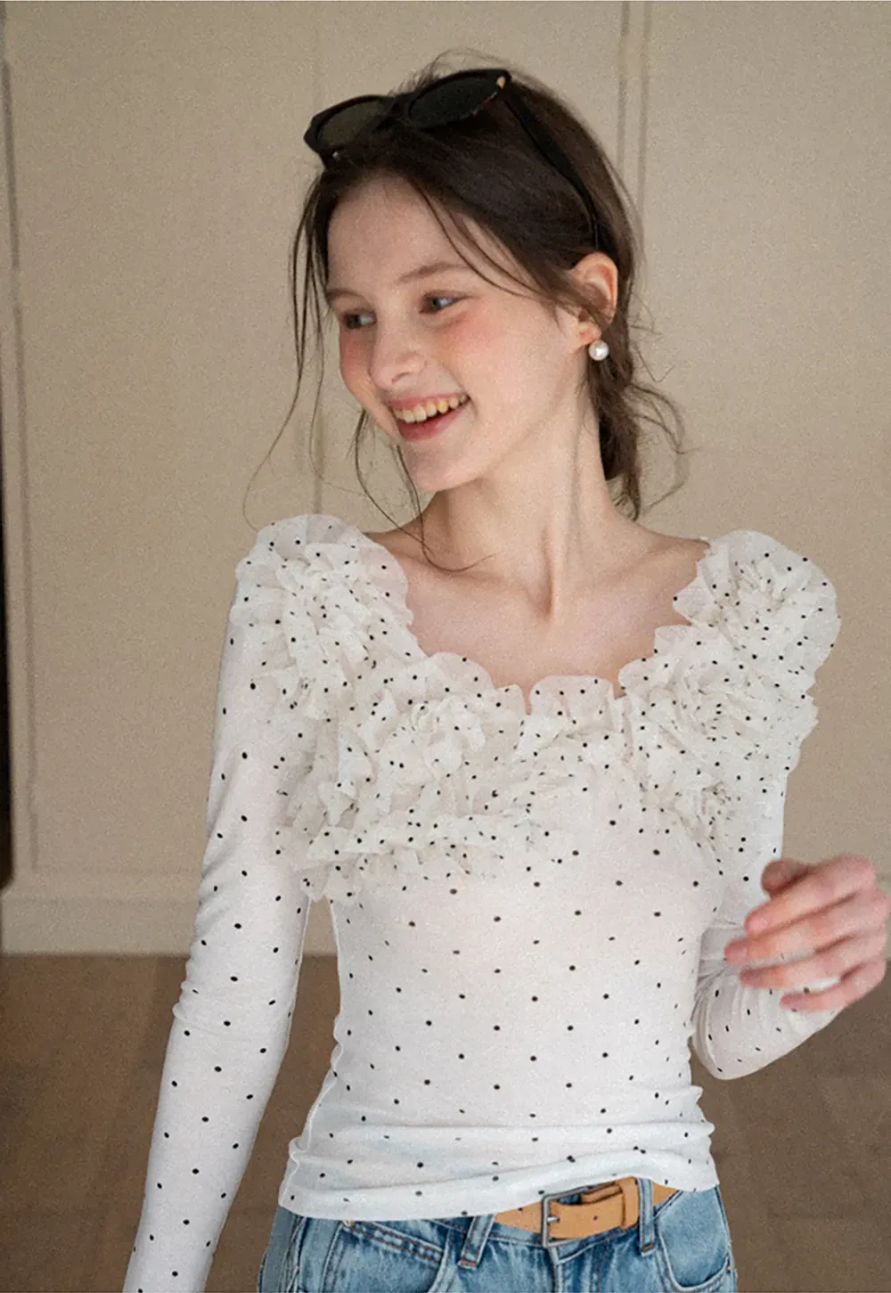 Polka dot long sleeve top with ruffled neckline