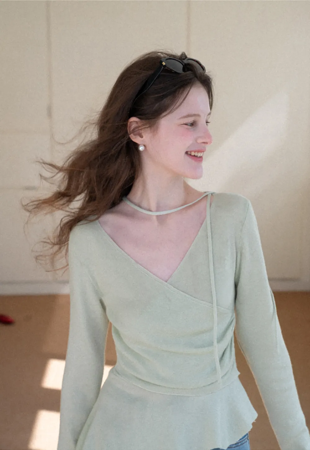 Long sleeve wrap knit sweater with ruched detail