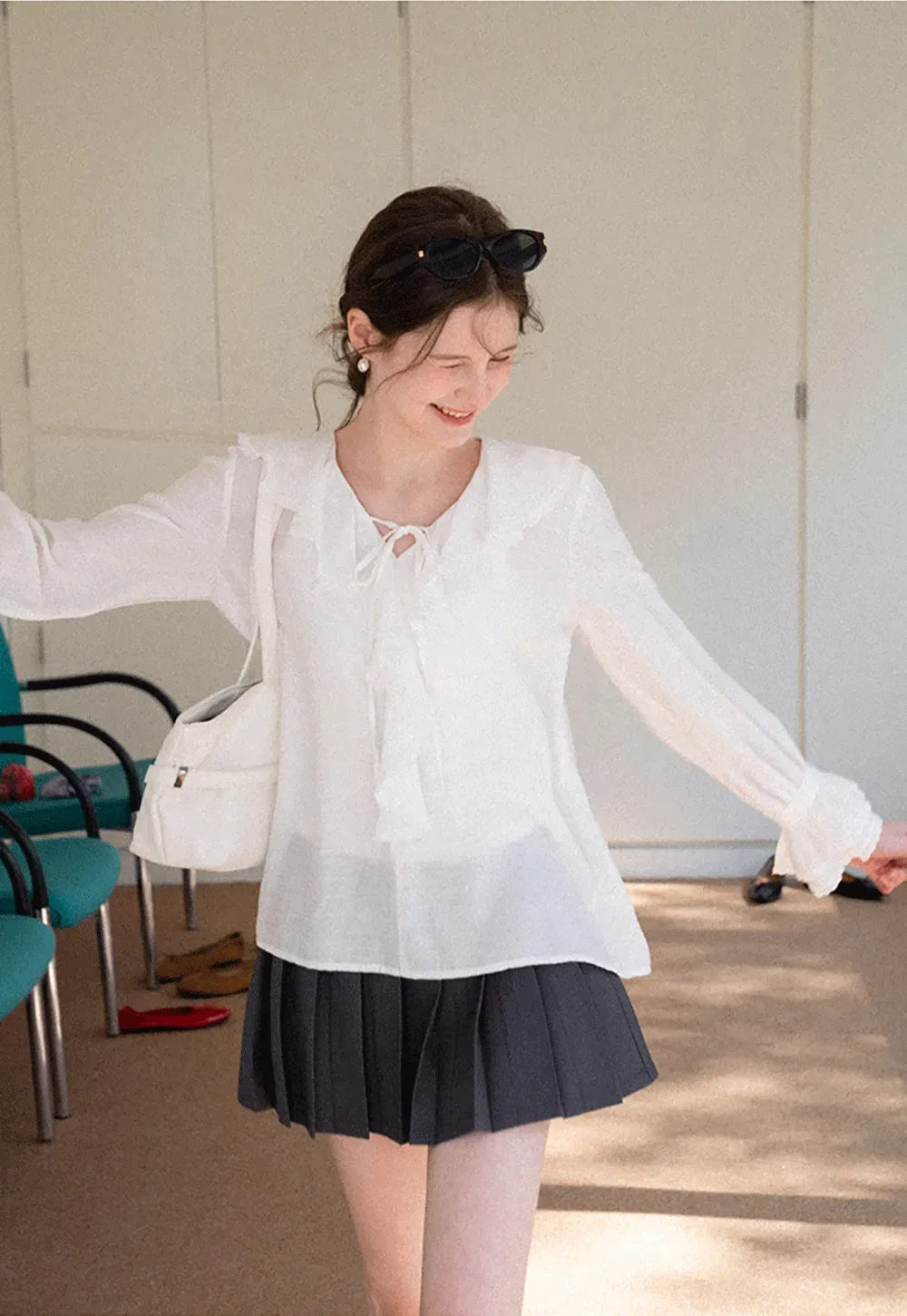 Elegant Blouse with Ruffled Neckline and Flared Sleeves