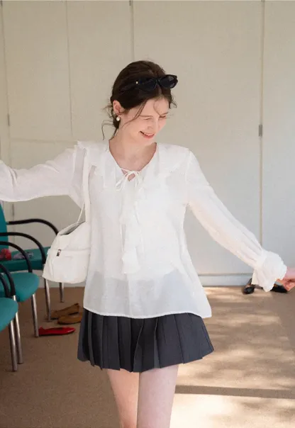 Elegant Blouse with Ruffled Neckline and Flared Sleeves