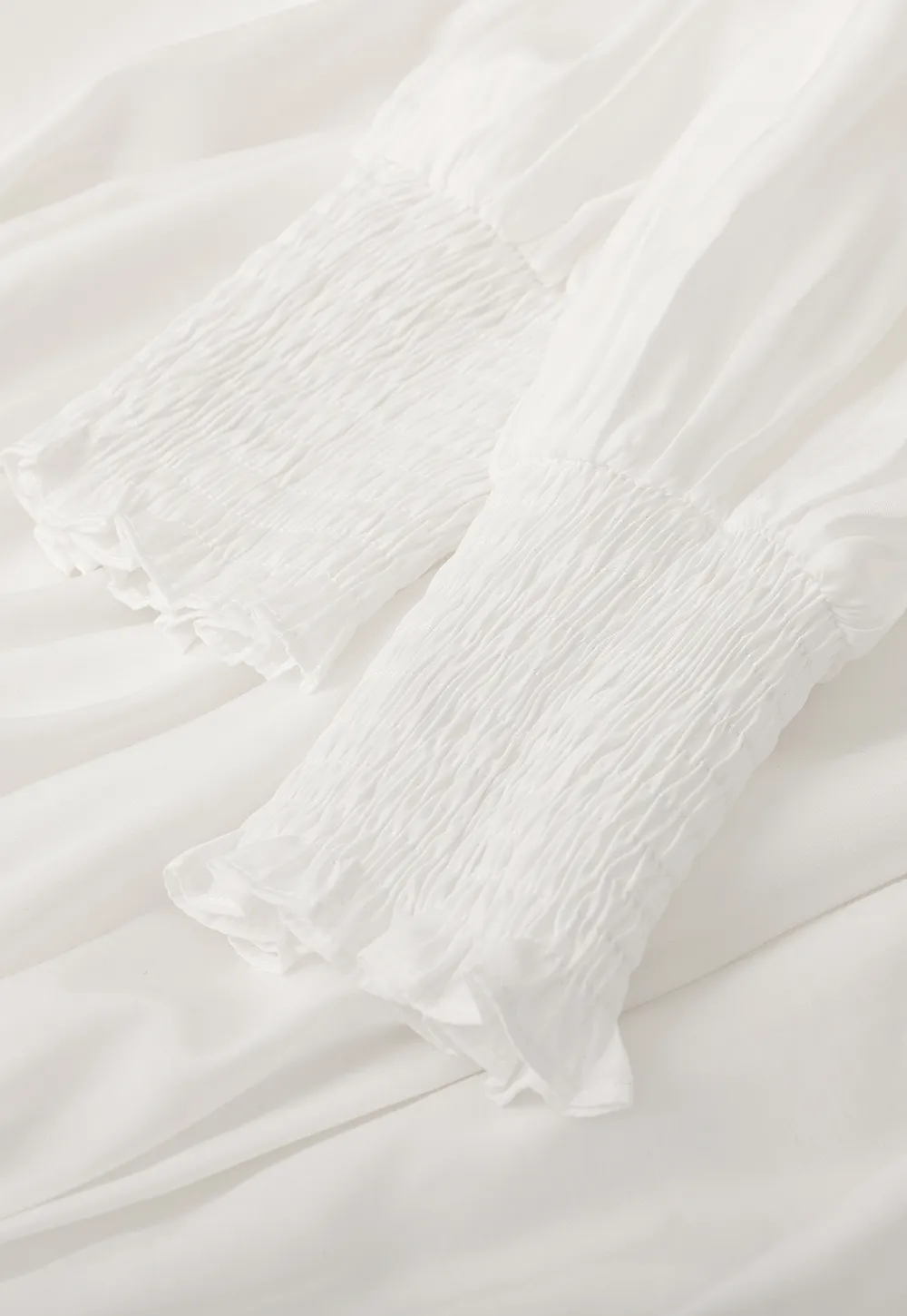 Elegant High Neck Blouse with Ruffled Cuffs and Hem