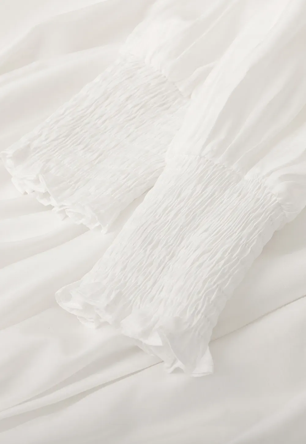 Elegant High Neck Blouse with Ruffled Cuffs and Hem