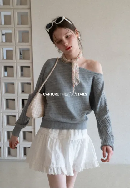 Ribbed knit sweater with wide neckline and long sleeves