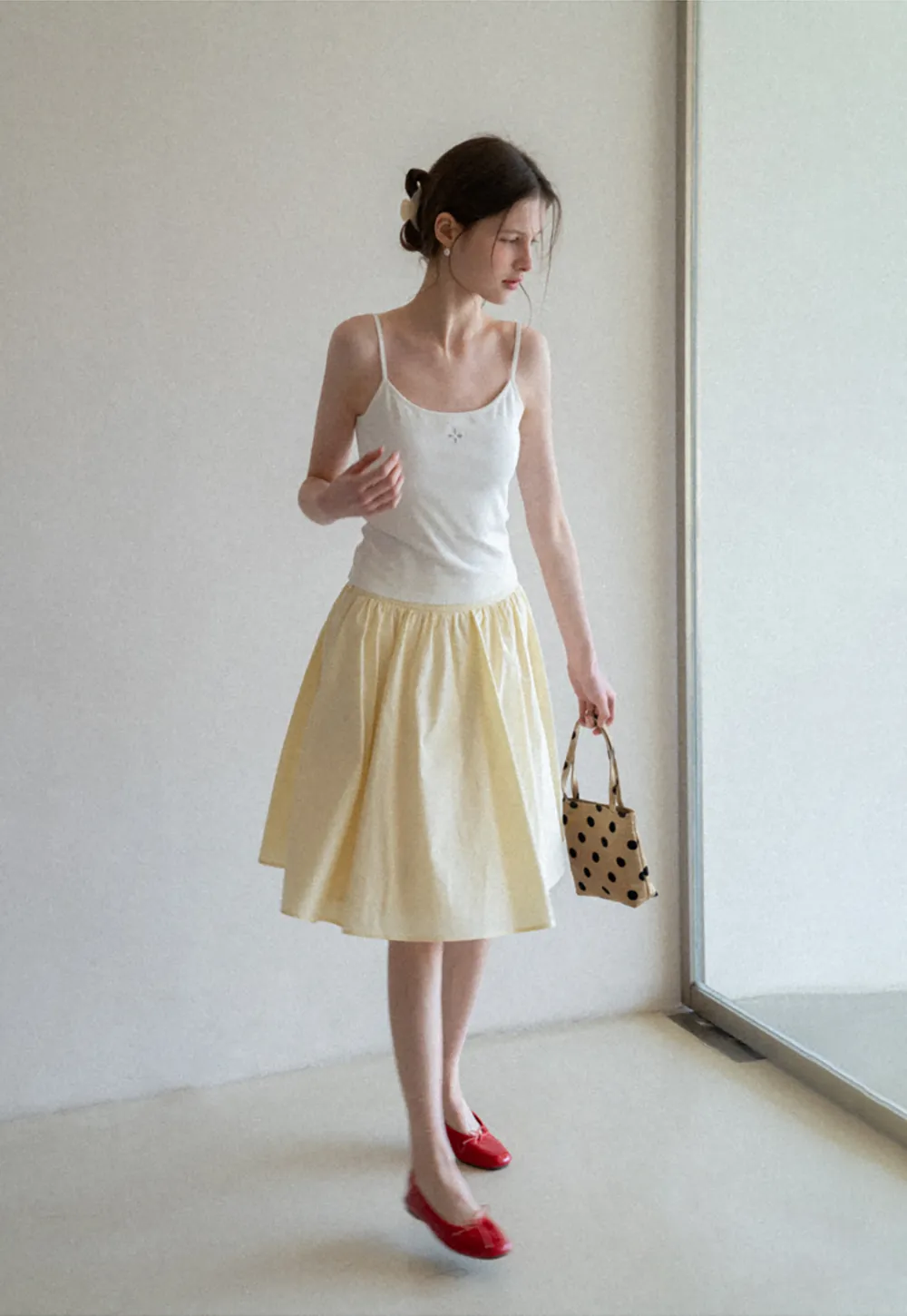 Gray tank top with small embroidered cross detail