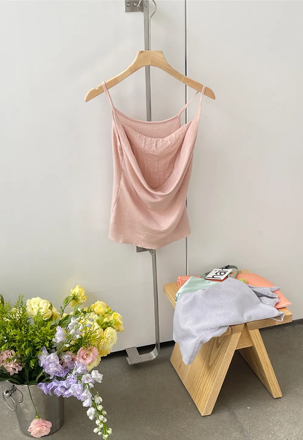 Silk-like tank top with thin straps and draped neckline