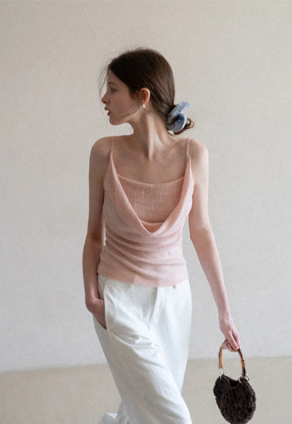 Silk-like tank top with thin straps and draped neckline
