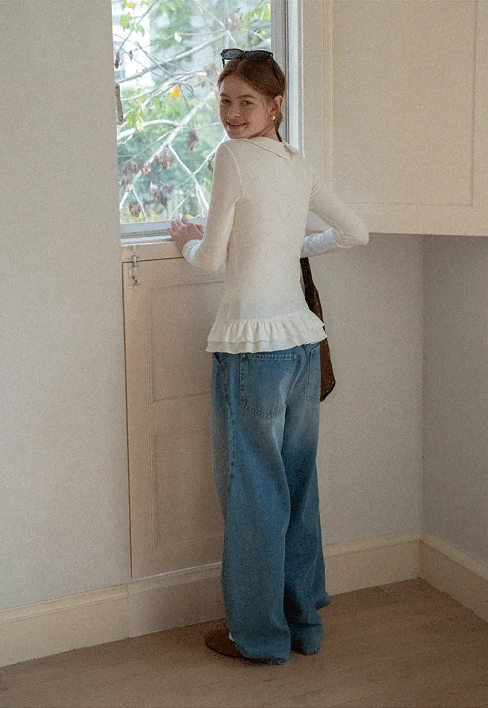 Elegant Long Sleeve Top with Ruffled Hem and Collar Design