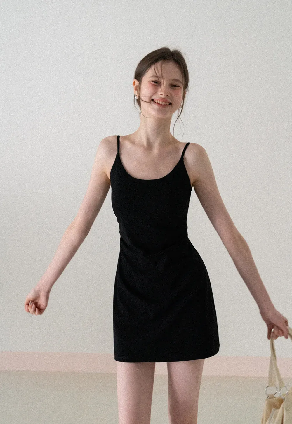 Sleeveless fitted mini dress with thin straps