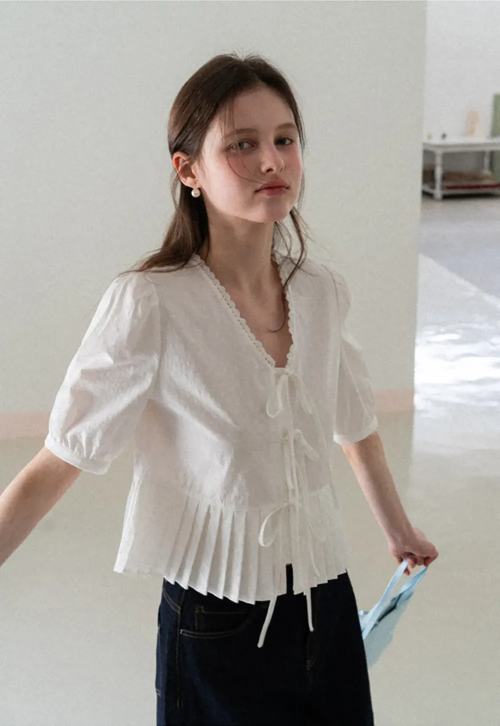 V neck short sleeve blouse with pleated hem and tie front