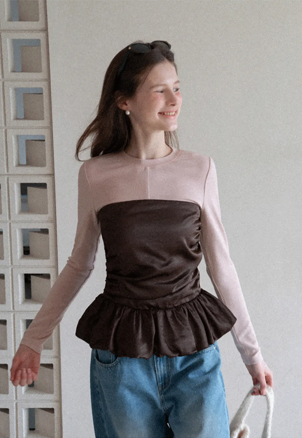 Long sleeve top with ruffled hem and layered design