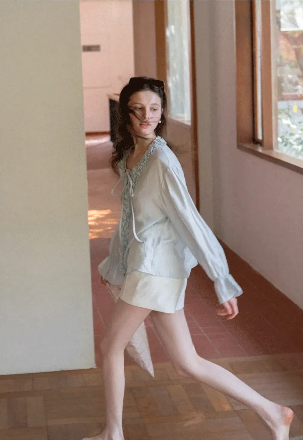 Long sleeve shirt with ruffled neckline and gathered cuffs