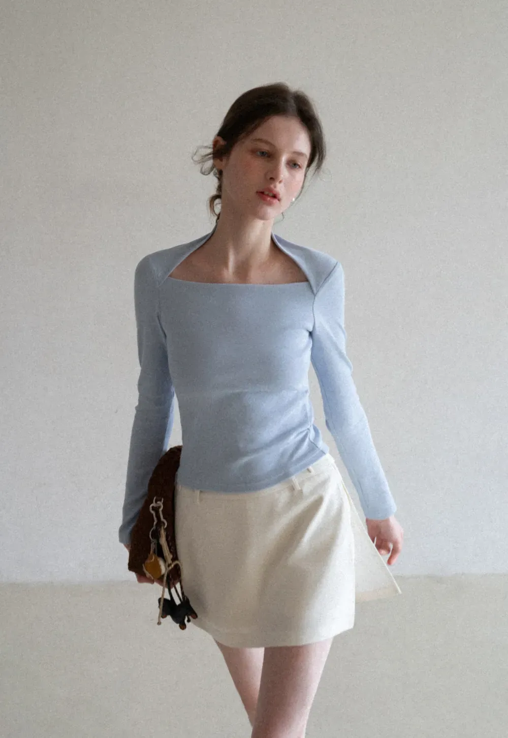 Elegant Pleated Mini Skirt with Asymmetrical Hem