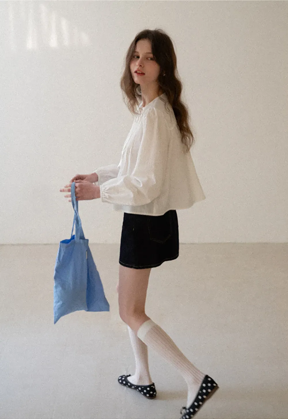 Pleated blouse with tie neck and long sleeves