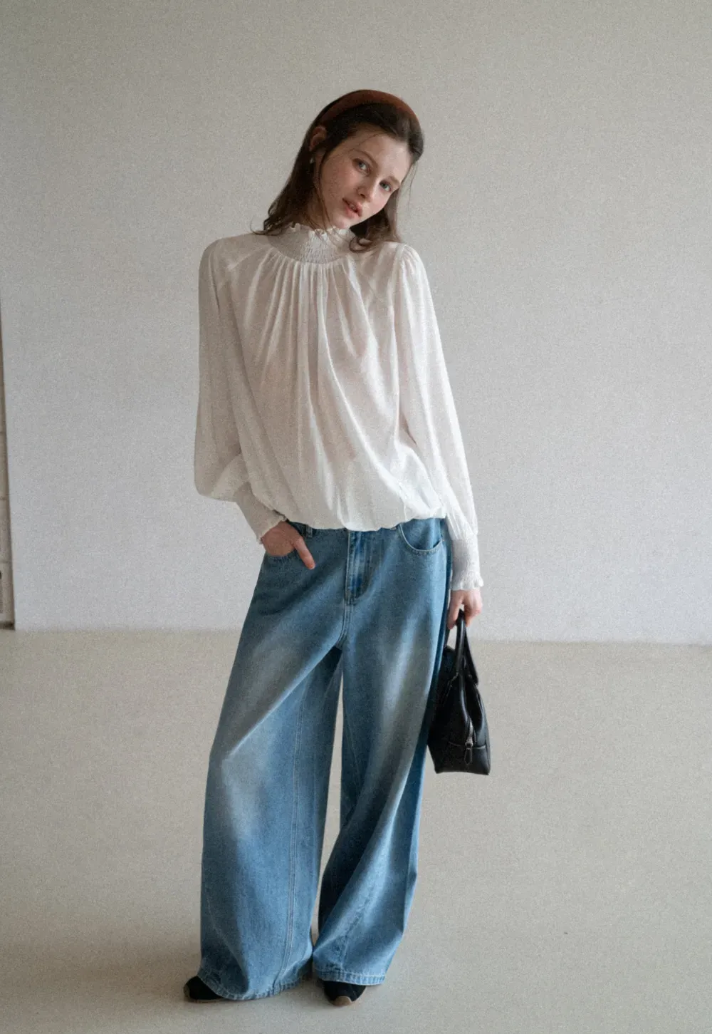 Elegant High Neck Blouse with Ruffled Cuffs and Hem