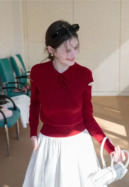 Elegant Knit Sweater with Bow Detail and Cutout Sleeves