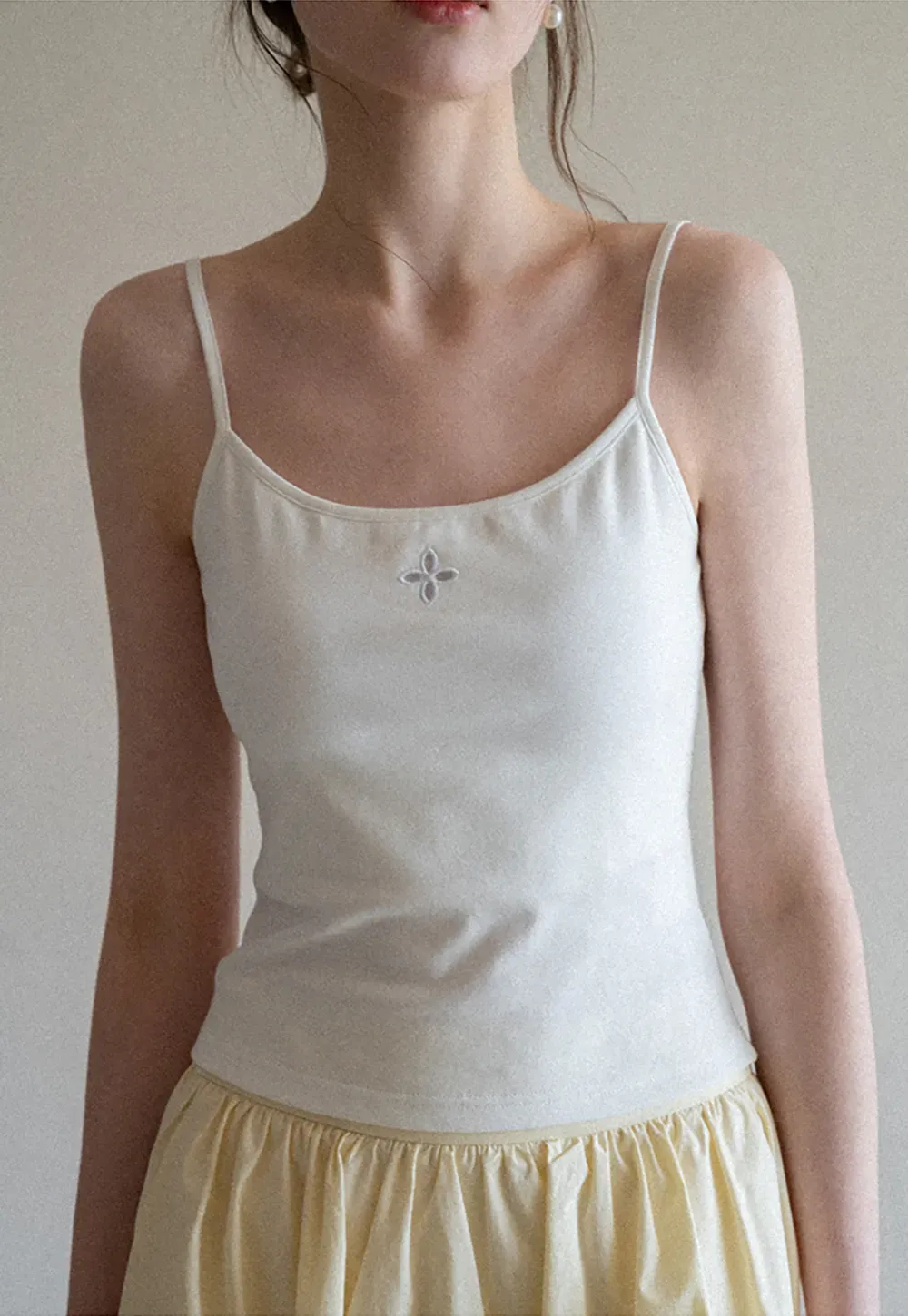 Gray tank top with small embroidered cross detail
