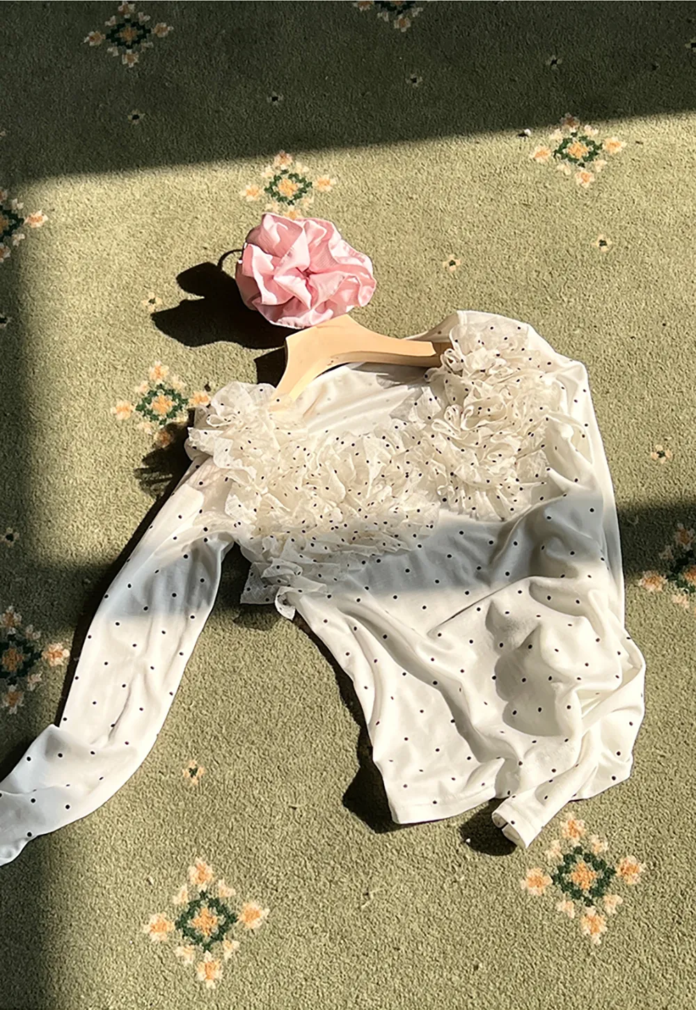 Polka dot long sleeve top with ruffled neckline