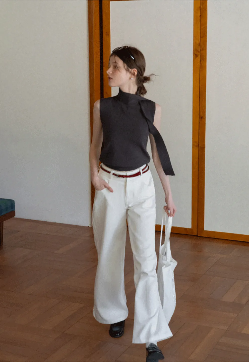 Sleeveless high neck knit top with side tie detail