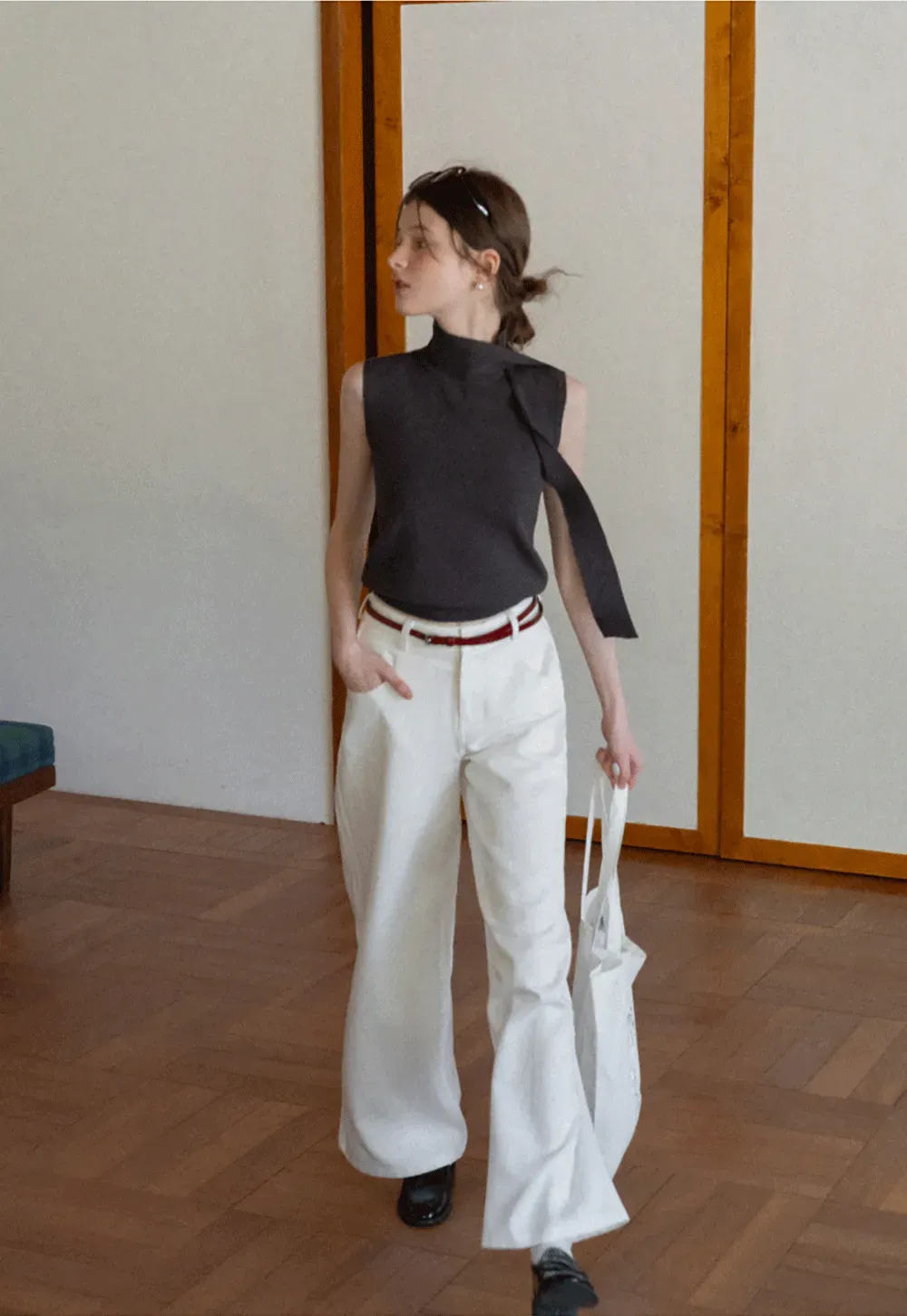 Sleeveless high neck knit top with side tie detail