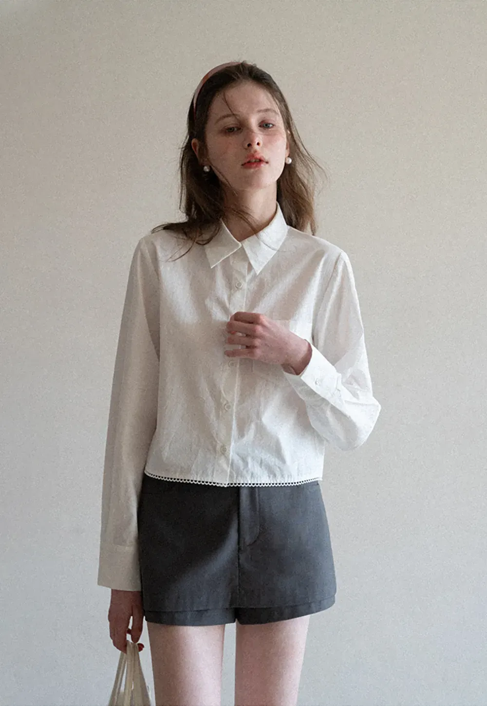 Long sleeve button front shirt with scalloped hem