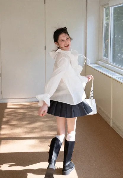 Elegant Blouse with Ruffled Neckline and Flared Sleeves