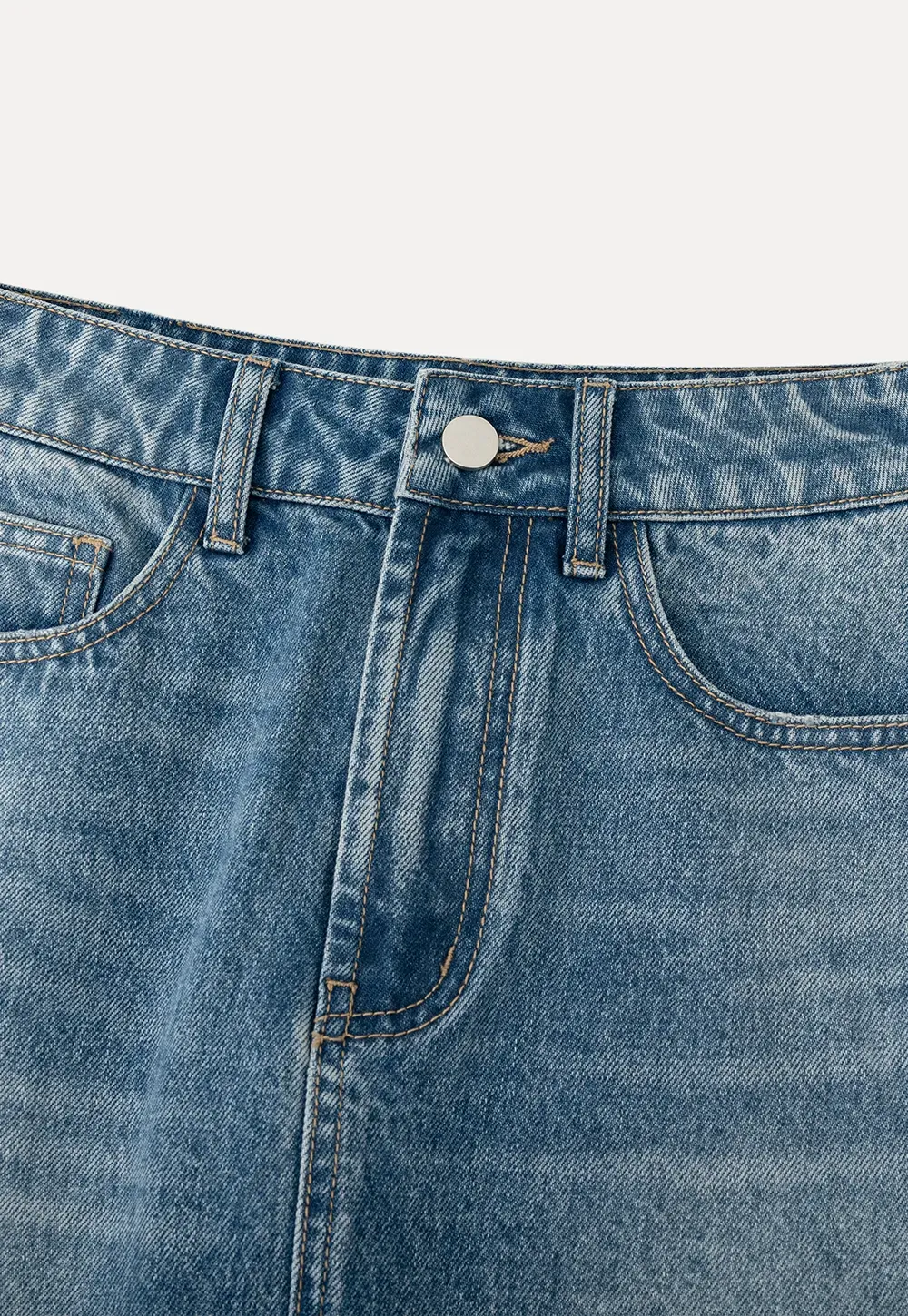 Denim mini skirt with frayed hem and front pockets