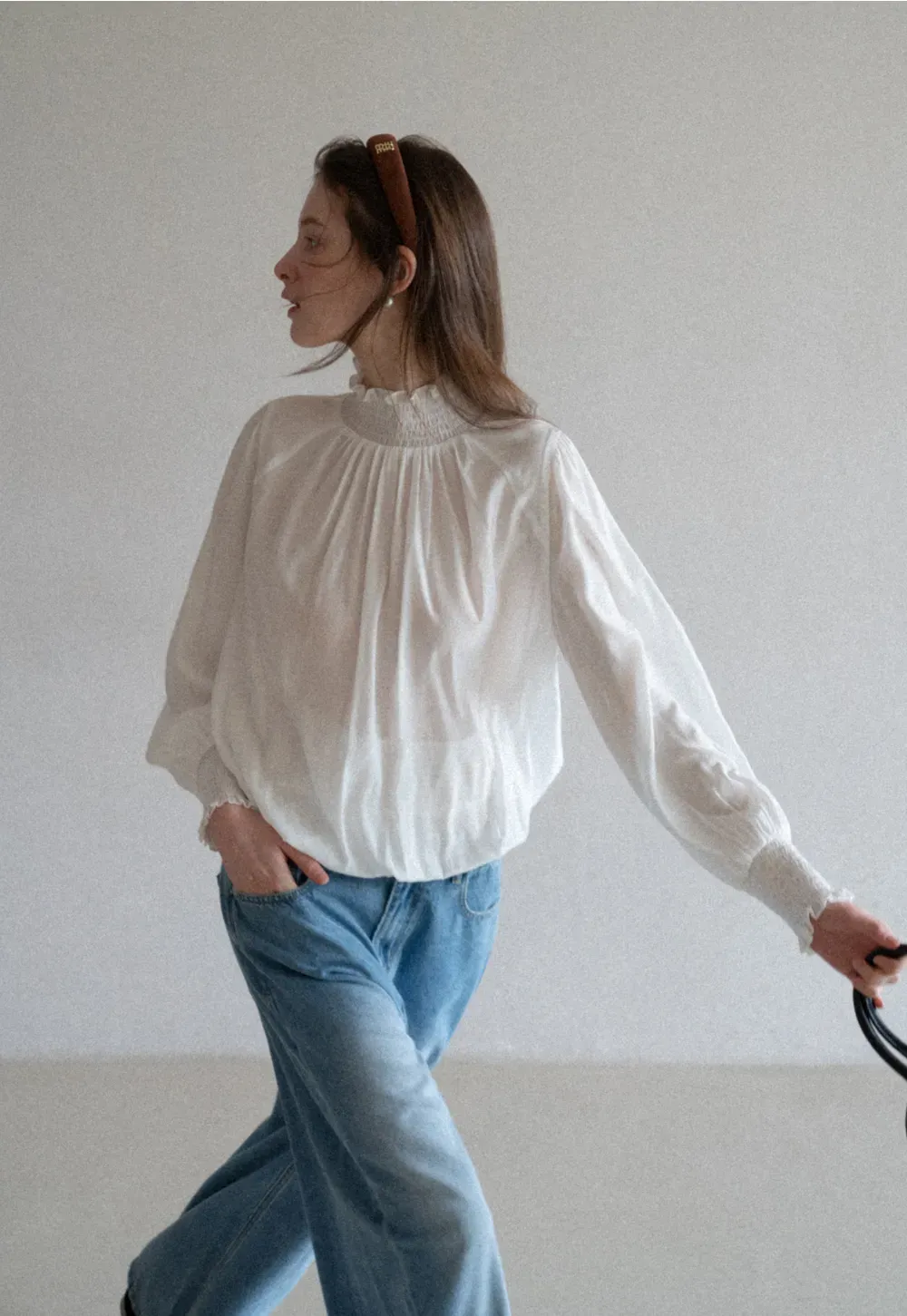 Elegant High Neck Blouse with Ruffled Cuffs and Hem