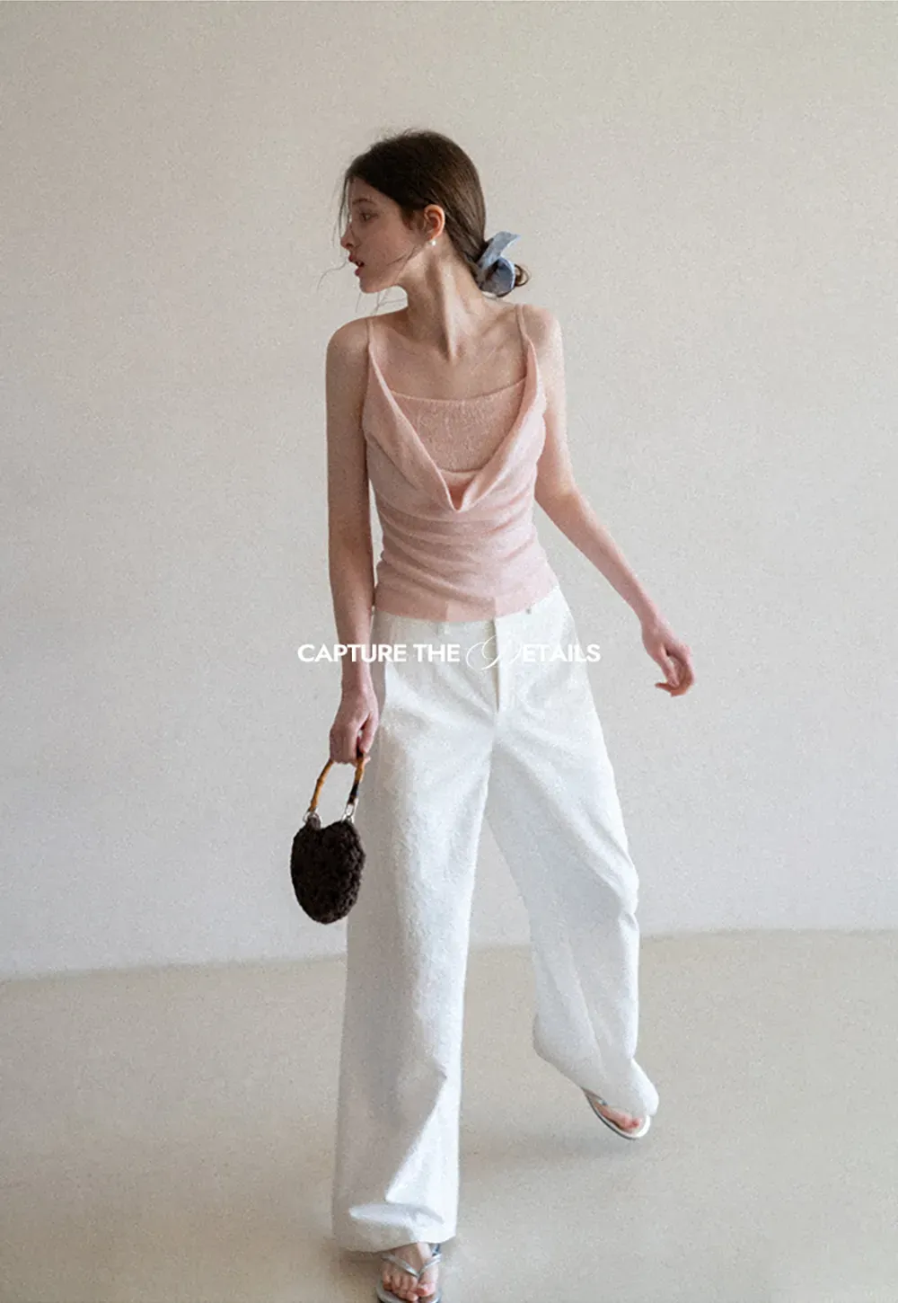 Silk-like tank top with thin straps and draped neckline