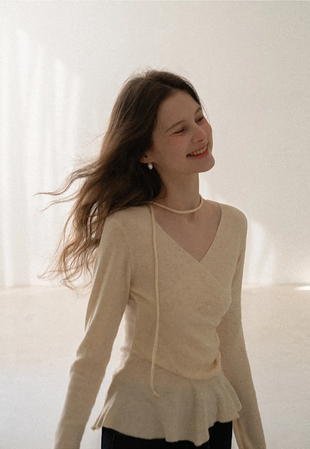 Long sleeve wrap knit sweater with ruched detail