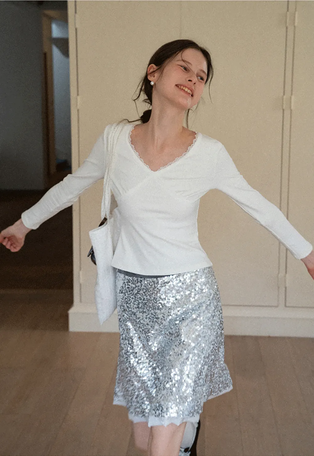 V neck long sleeve top with lace trim and fitted design