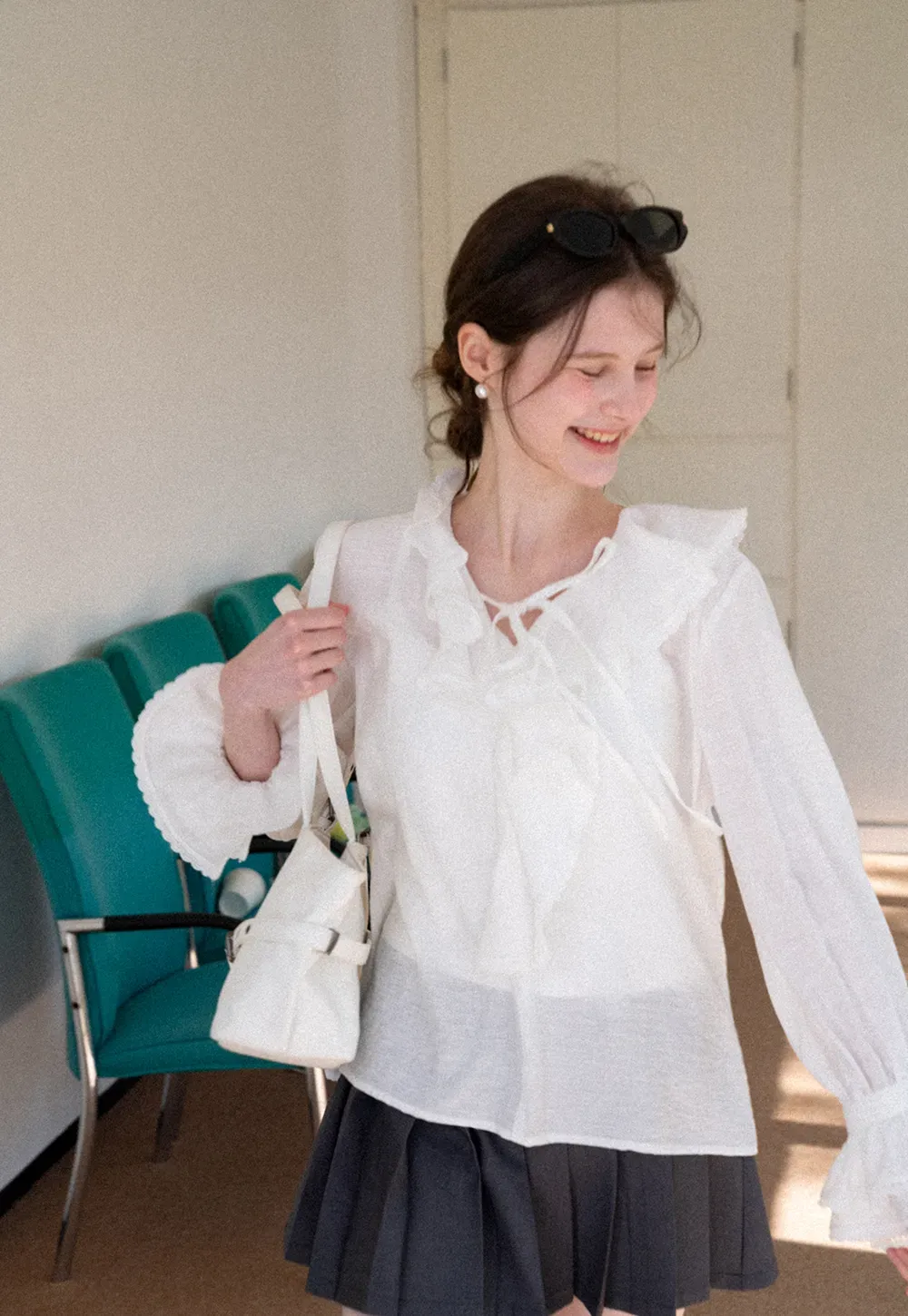 Elegant Blouse with Ruffled Neckline and Flared Sleeves