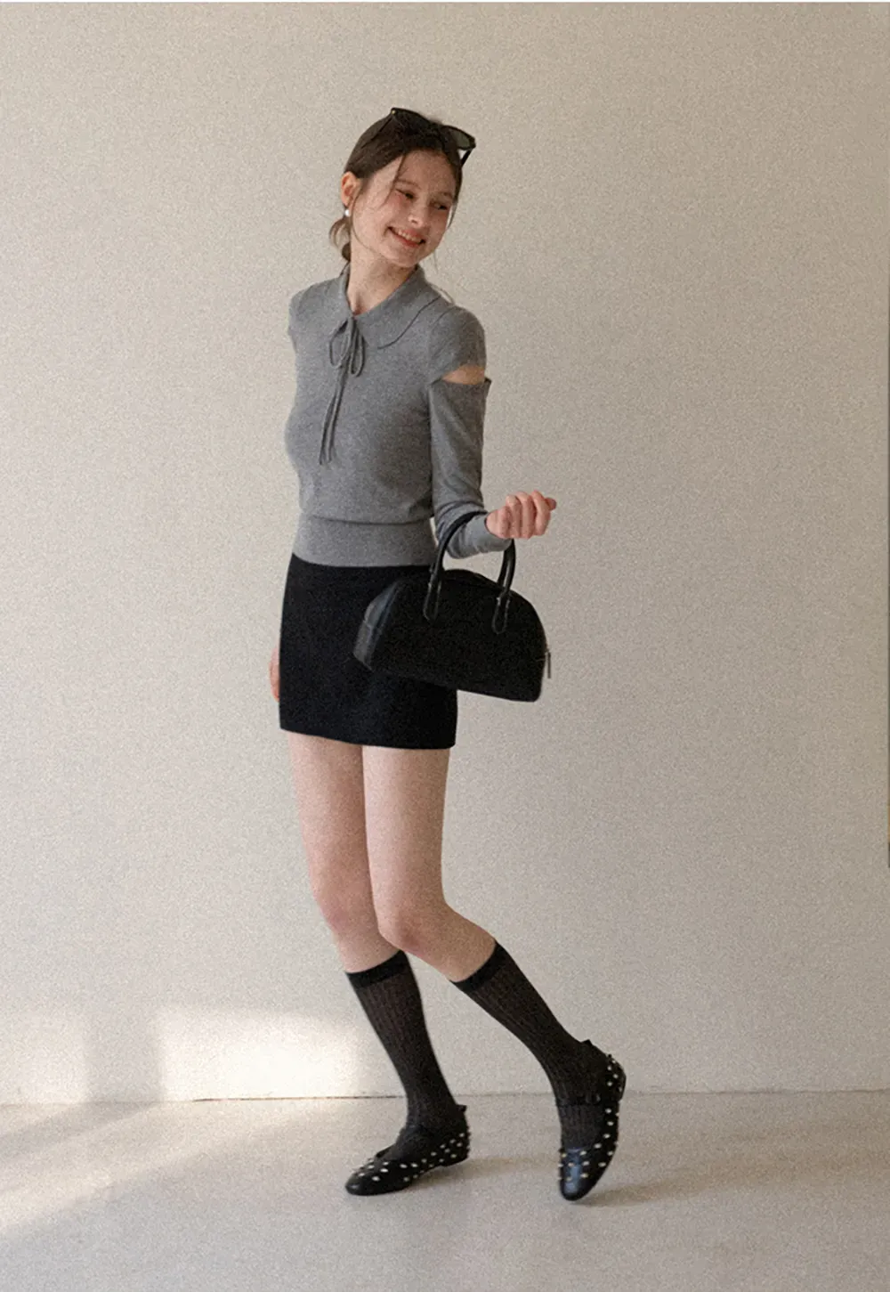 Elegant Knit Sweater with Bow Detail and Cutout Sleeves