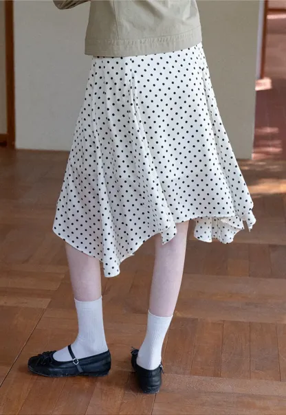 Polka dot asymmetrical hem skirt with pleats